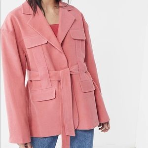 Oversized pink belted corduroy trench coat